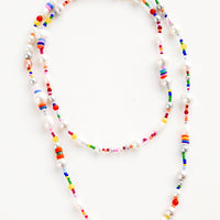 1: Long, layered beaded necklace in a mix of round pearl beads and rainbow colored beads