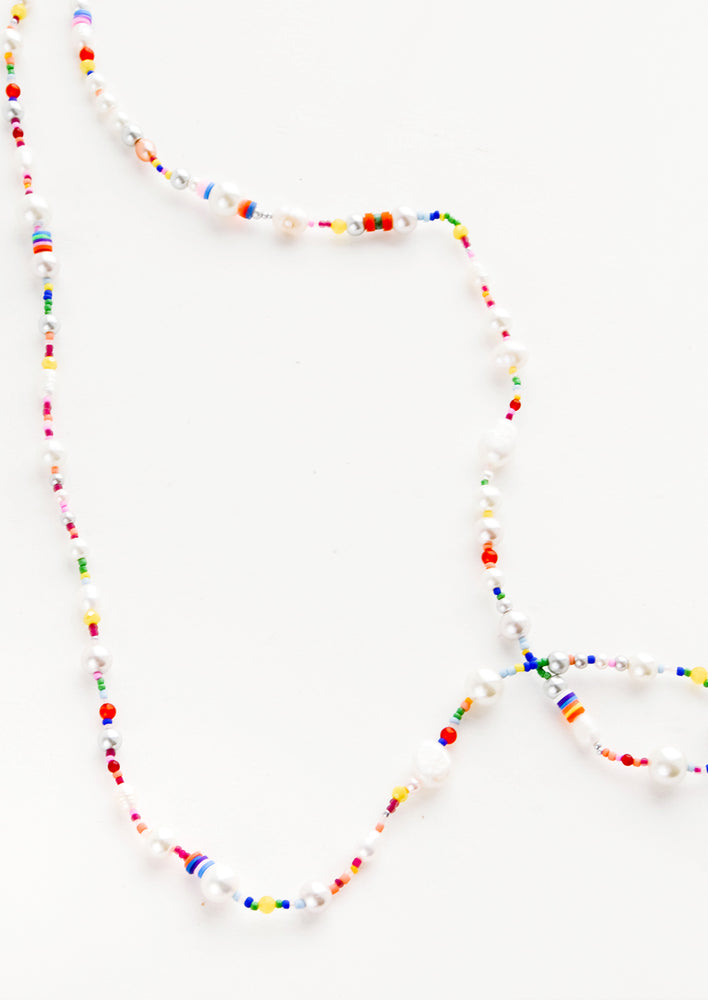 Long beaded necklace with a mix of pearl, glass and colorful plastic beads