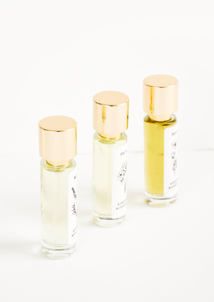 2: Perfume bottles with beautiful botanical labels, ranging in color from clear to green liquid