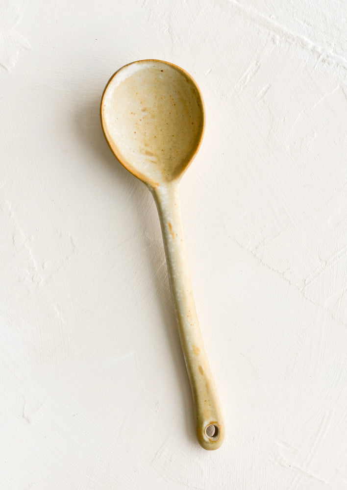A ceramic spoon in natural tan.