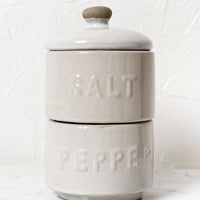 1: Stackable white ceramic salt and pepper jar with lid.