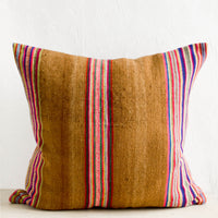 1: Square throw pillow in striped vintage wool fabric. Brown with colorful rainbow stripes.