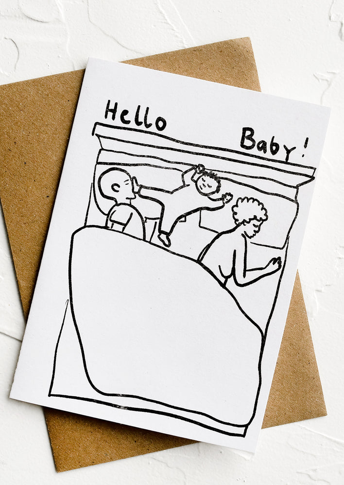 1: A black and white greeting card with illustration of baby in a bed.