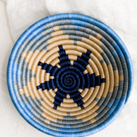 1: A blue and tan woven sweetgrass catchall with star pattern.