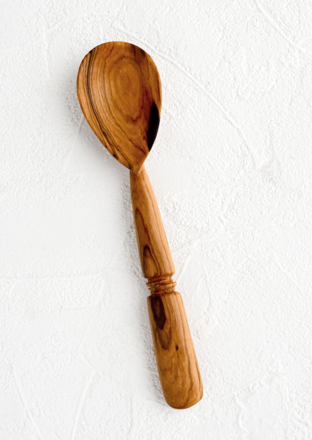 2: A hand carved spoon with inset "band" detailing on handle.