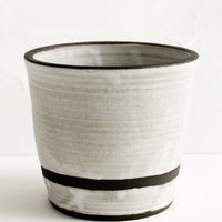Oyster / Chocolate [$42.99]: A ceramic utensil holder in oyster.