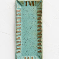 Turquoise Speckle: A rectangular ceramic butter dish with textured border in turquoise speckle.
