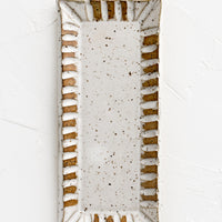 White Speckle: A rectangular ceramic butter dish with textured border in white speckle.