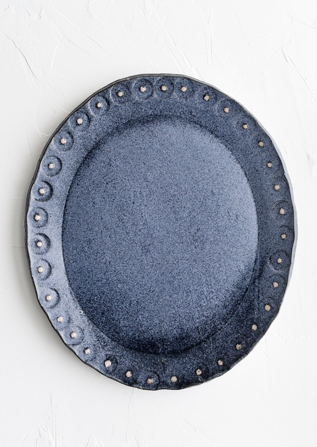 Steel Blue / Pink: An oval shaped ceramic platter in steel blue with pink dot trim.