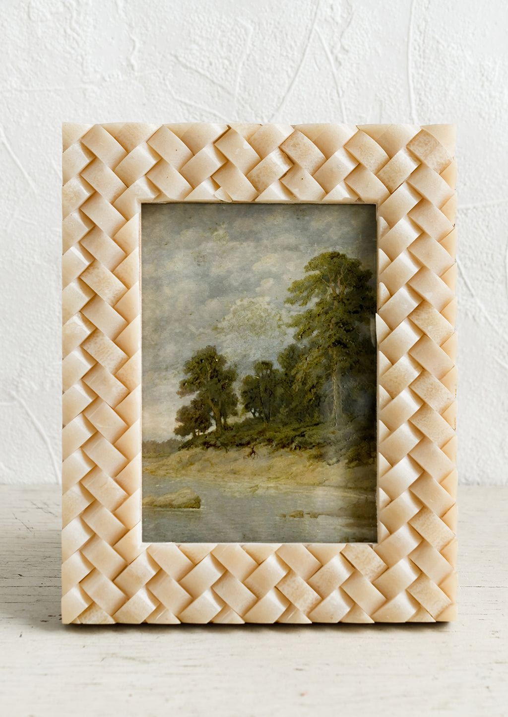 1: A resin picture frame in tan with basketweave texture.