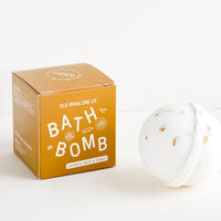 Oatmeal Milk & Honey: White colored, round bath bomb with brown box packaging