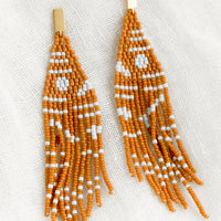 Cedar Multi: A pair of beaded earrings with geometric pattern in cedar and white.