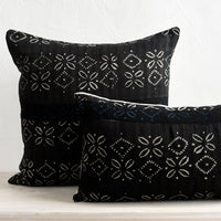 1: Black vintage fabric pillows in square and lumbar sizes.
