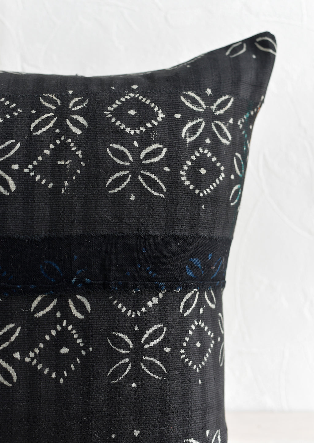 3: Batik strip cloth fabric in dark color with light print.