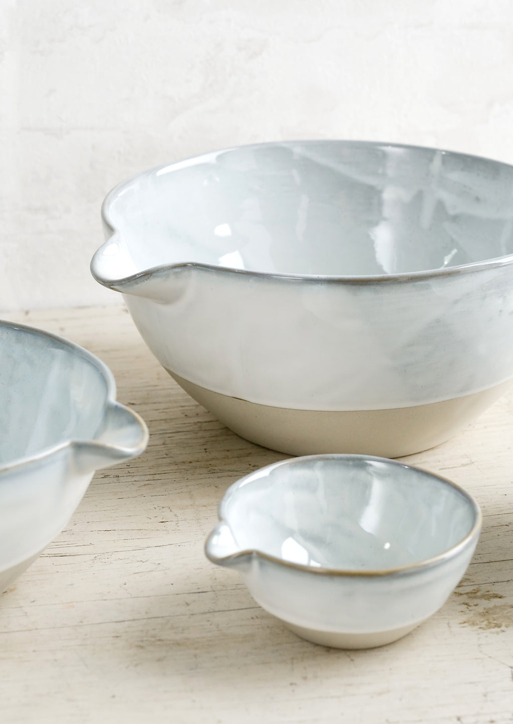 4: Ceramic bowls with pouring spouts in three sizes.