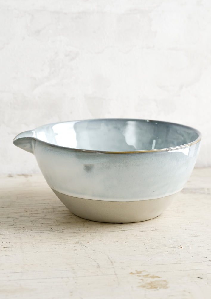 3: A ceramic bowl with pouring spout.