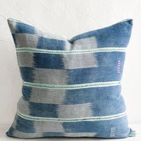 1: A pillow made from indigo ikat fabric.