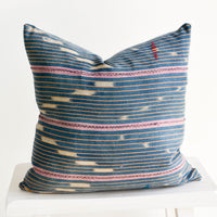 3: Throw pillow made from vintage indigo Baule fabric with peach and pink stripes