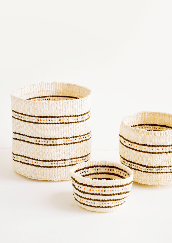 Natural sisal grass baskets in incremental sizes with stripes and rainbow beading