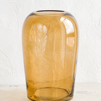 Amber / Large: An empty glass vase in tall shape and amber brown color.