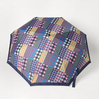 2: A nylon umbrella in checkered patchwork print.