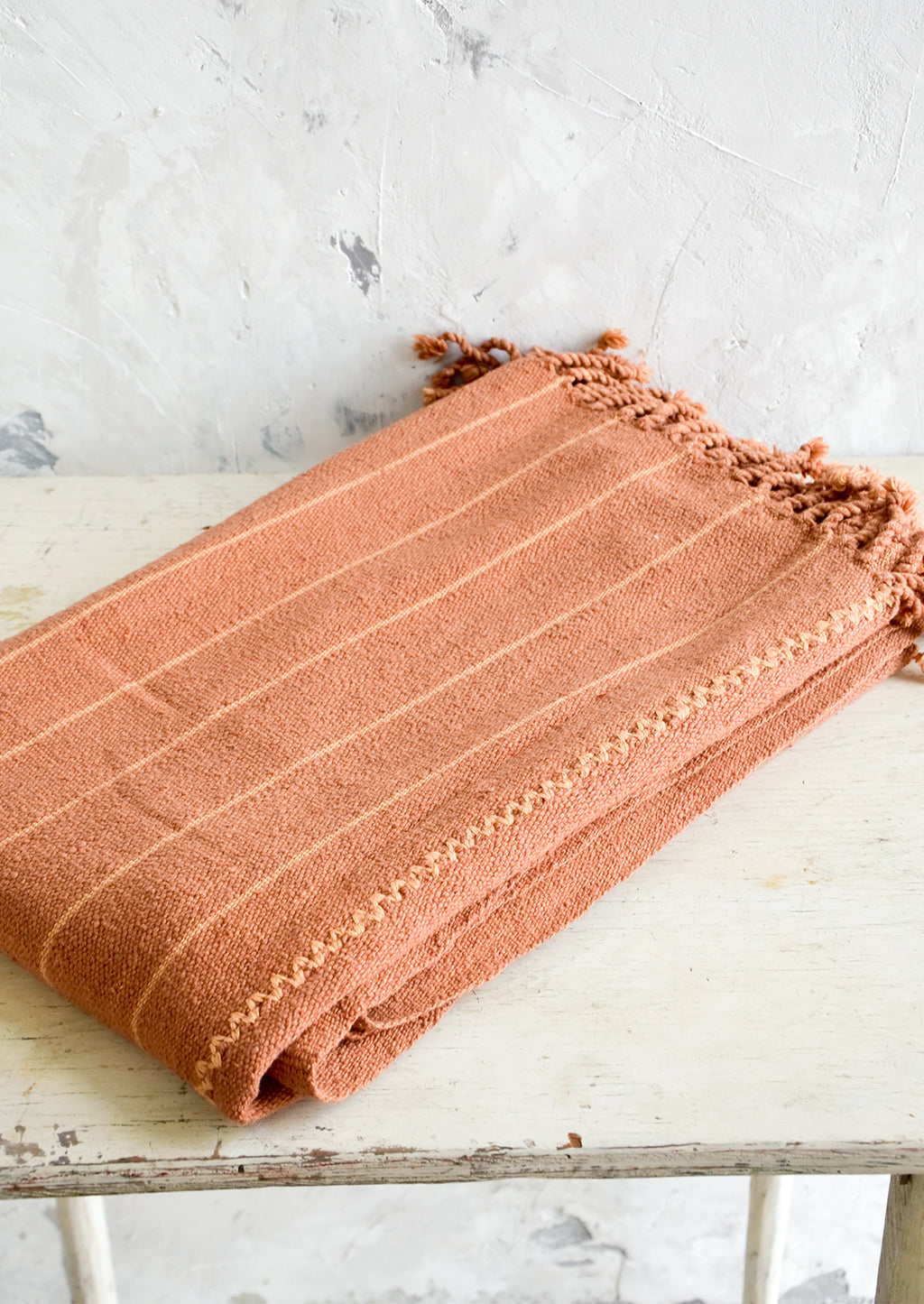 Terracotta / Peach: Natural woven cotton throw in peach and terracotta stripes with twisted fringe edge