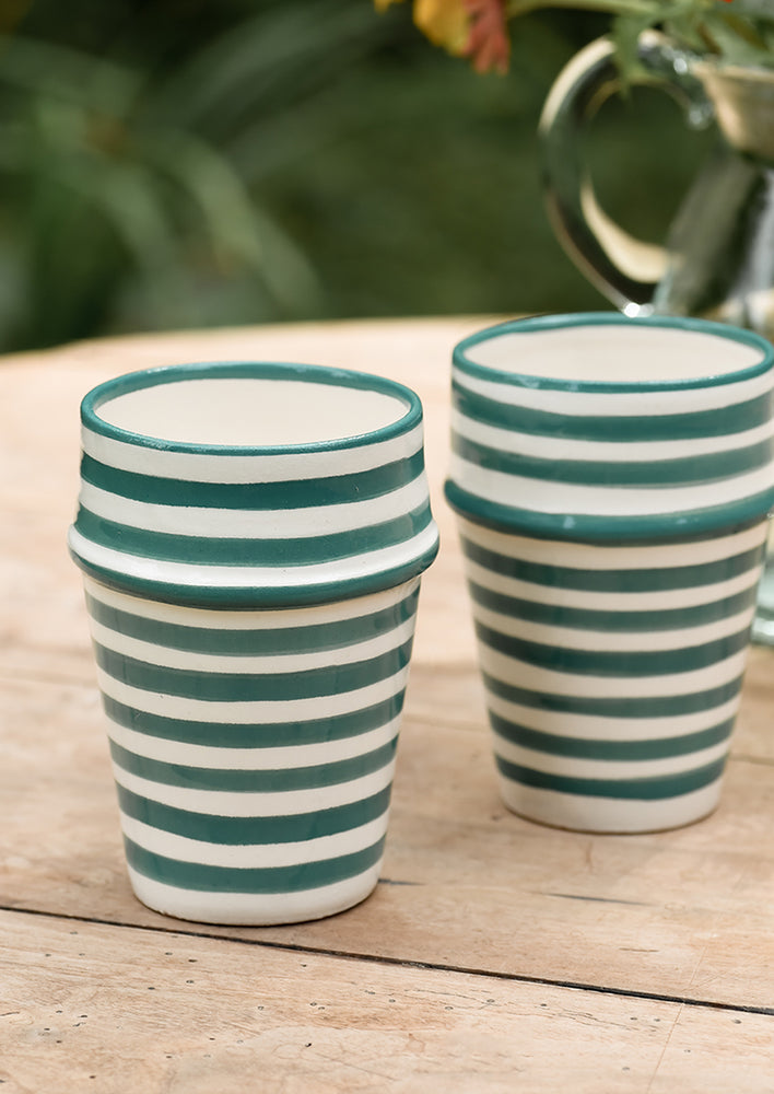 Two moroccan Beldi cups in striped teal ceramic.