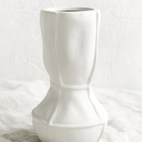 Tall: A tall geometric vase in matte white ceramic.