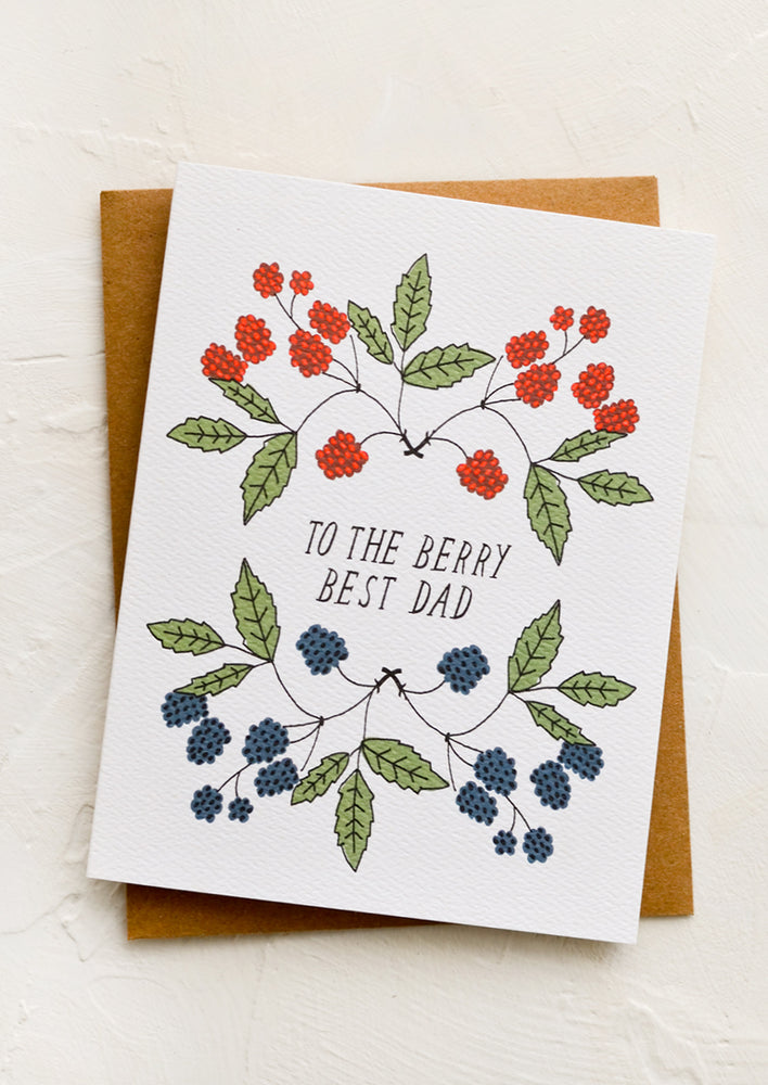 A greeting card with illustrated raspberries and text reading "To the berry best dad"