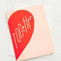1: A greeting card with image of half of a red heart and text reading "Together".
