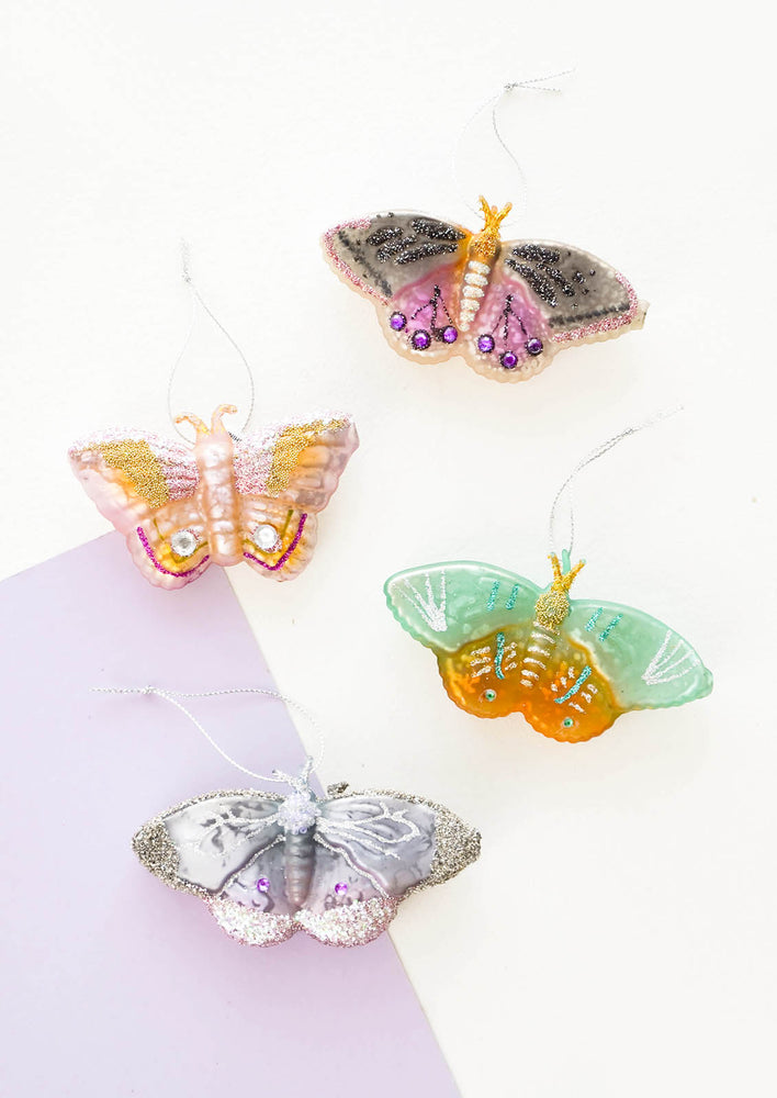 Assorted butterfly holiday ornaments in different colors