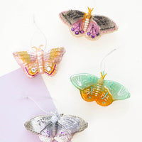 2: Assorted butterfly holiday ornaments in different colors