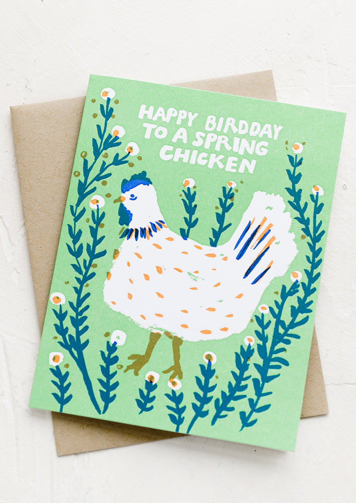 A greeting card reading "Happy bird day to a spring chicken".