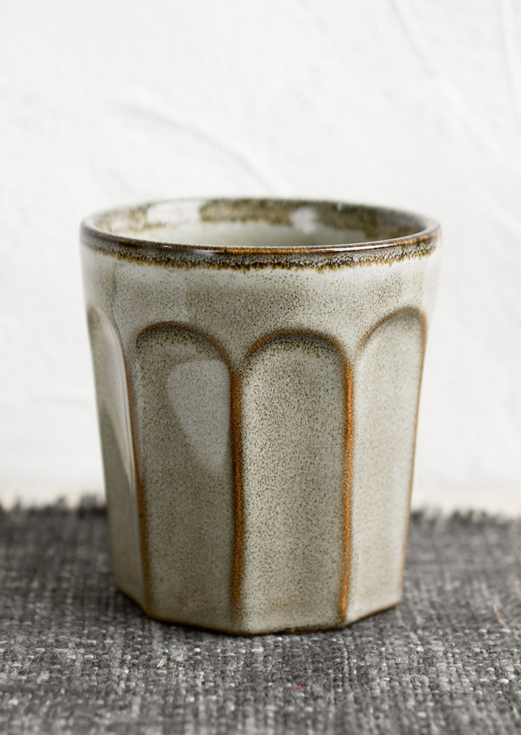 Glossy Pebble: A ceramic bistrot style cup in pebble (brownish-grey).
