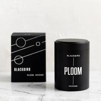 Ploom: A black incense tin with black and silver packaging.