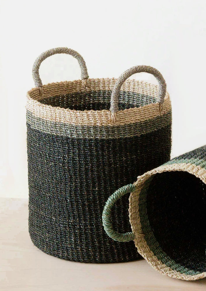 A tri tone storage basket with handles in black.