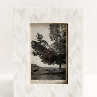 1: A picture frame in chevron pattern made from ivory bone.