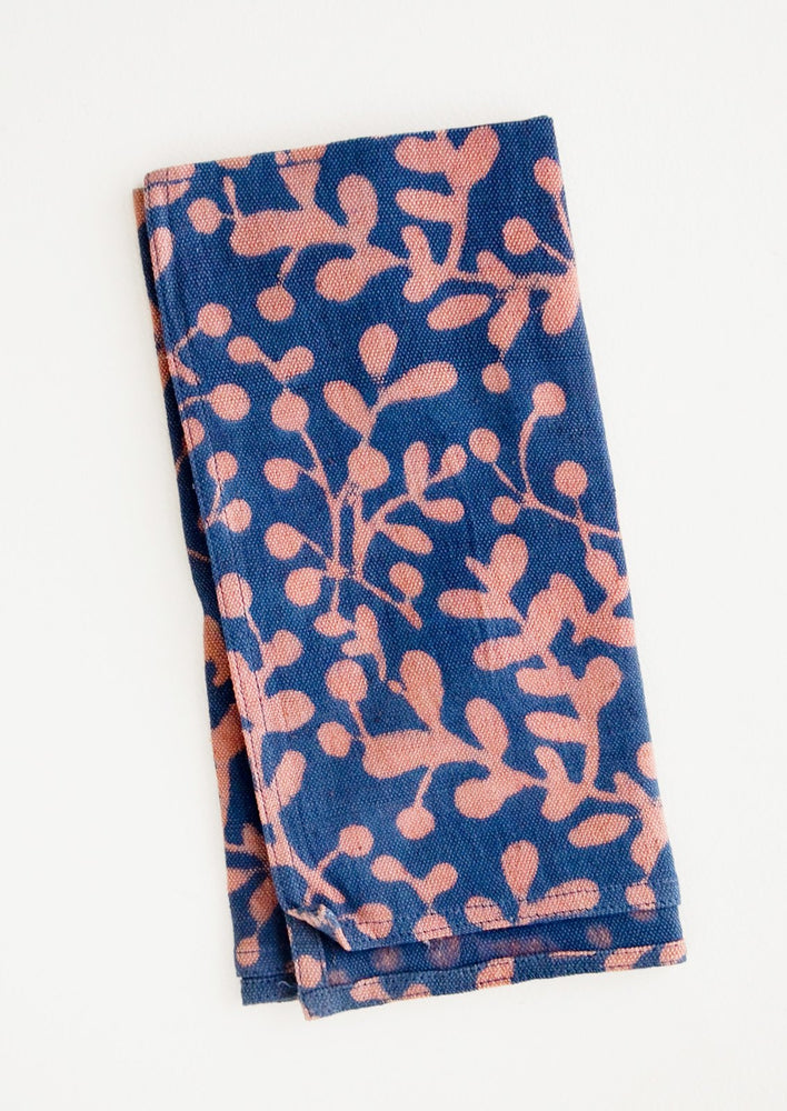 Block print cotton dinner napkin in blue with pink leaf print