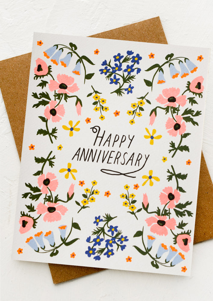 1: A floral print card with "Happy Anniversary" text at center.