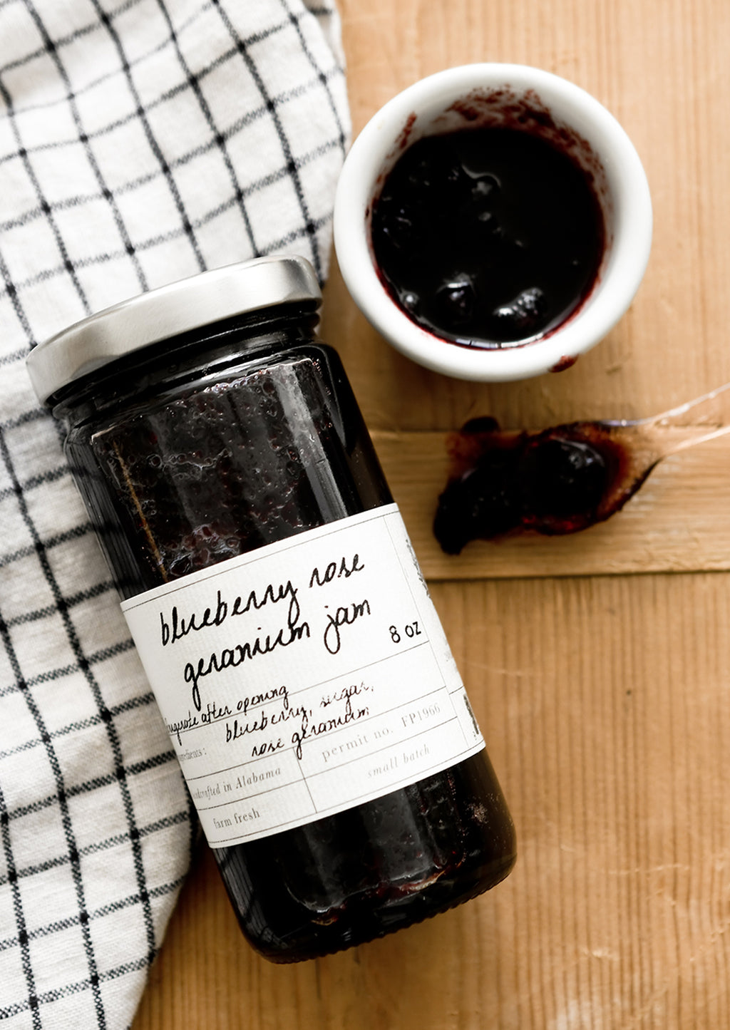 1: A glass jar of blueberry jam.