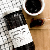 1: A glass jar of blueberry jam.