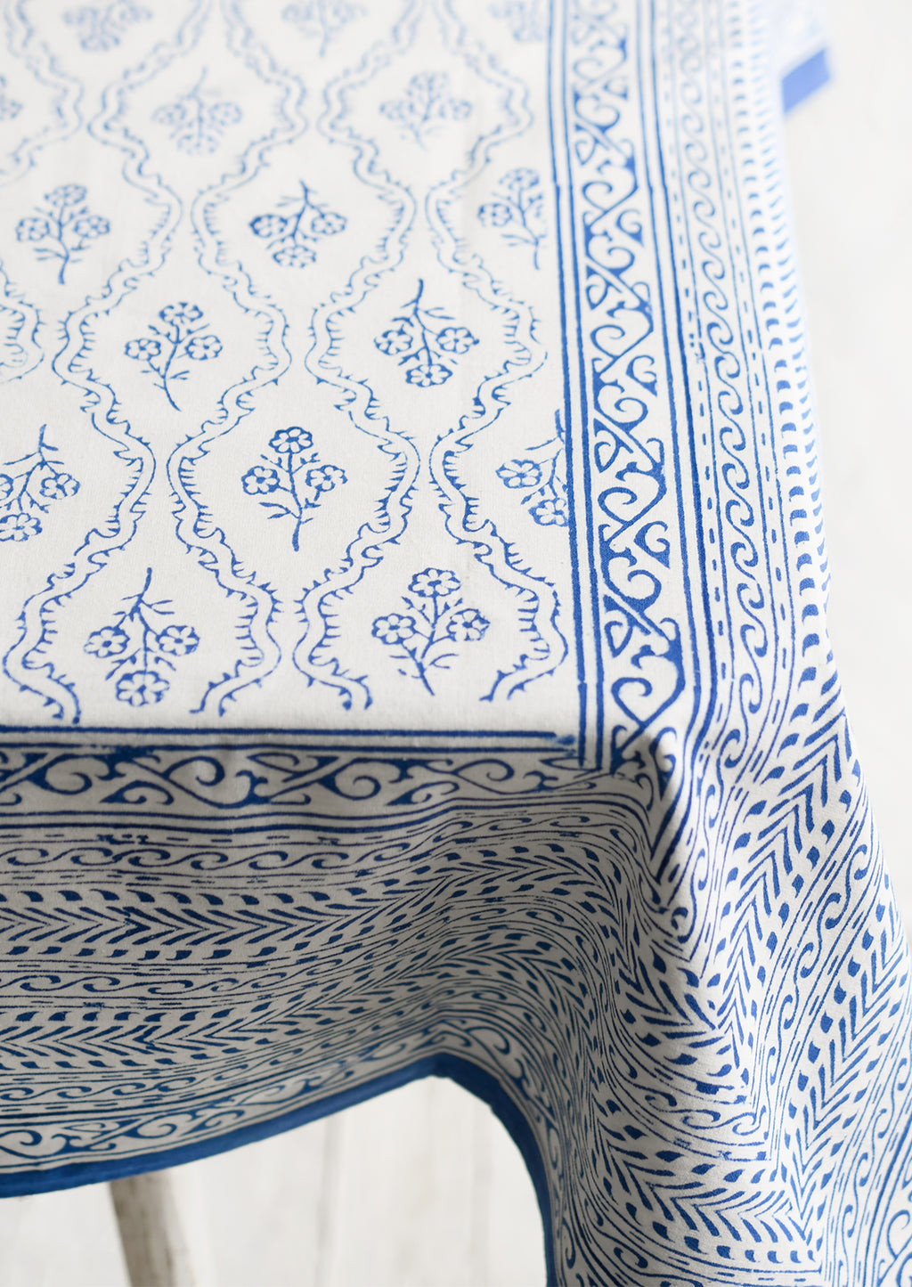 3: A blue and white block printed, floral print tablecloth.