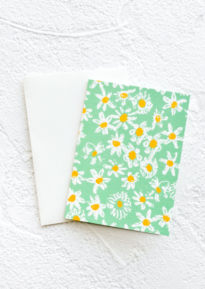 Green Daisies: A gift enclosure greeting card with a green background and daisy print.