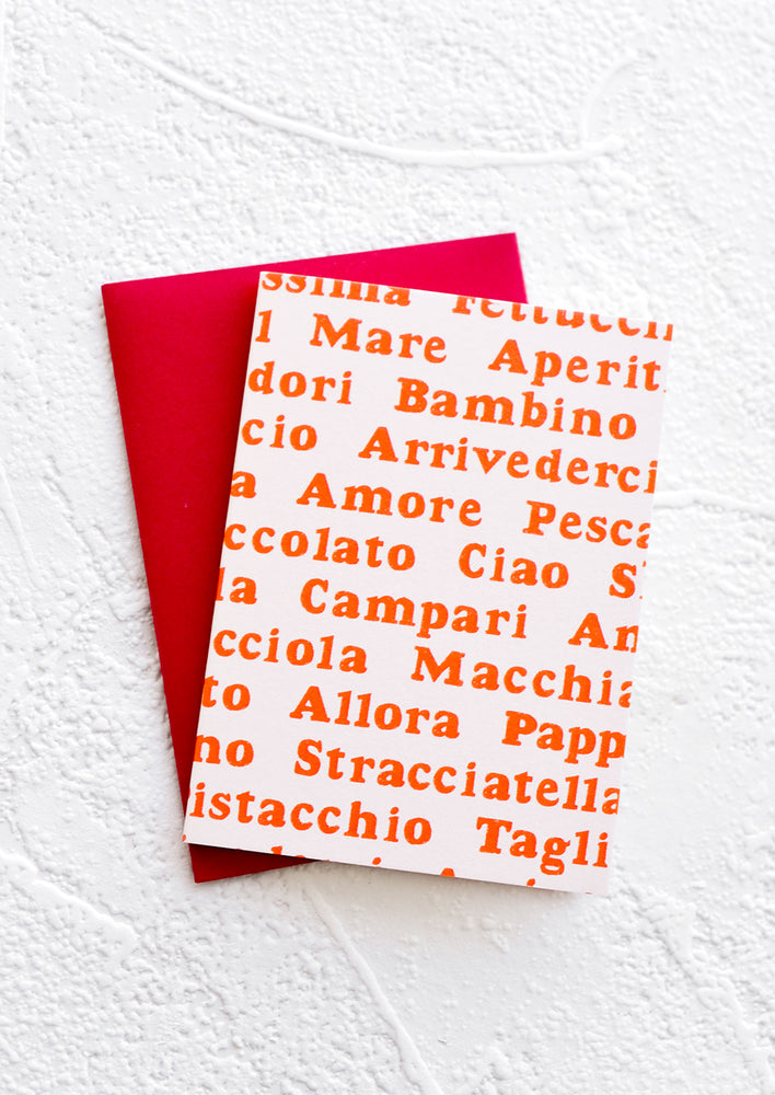 A gift enclosure greeting card with a pale pink background and Italian words printed in red text.