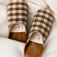 Small / Brown Multi: A pair of house slippers in lavender and brown gingham fabric.