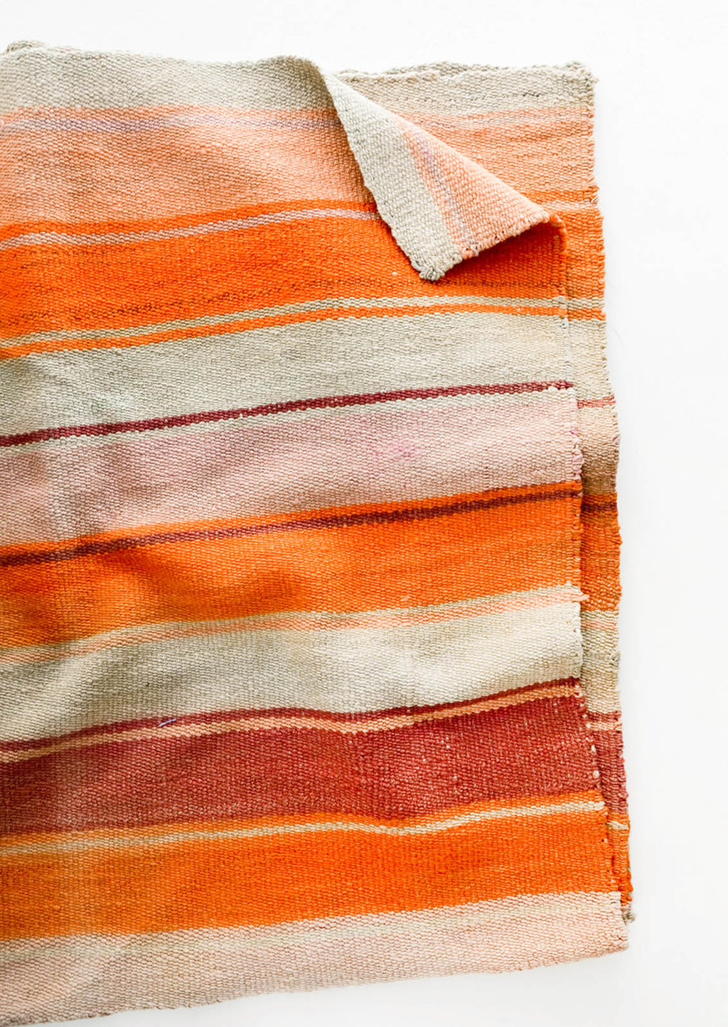 3: Woven textile intended for use as a rug or blanket, variegated colorful striped pattern.