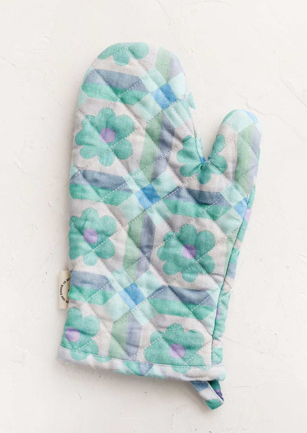 Cool Multi: An oven mitt with retro floral pattern in aqua and lavender.