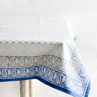 2: Chevron patterned tablecloth with paisley border in shades of blue, draped over a table