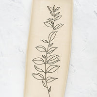 Bay Laurel: A long and skinny ceramic tray in natural bisque color with an etched black drawing of a Bay Laurel plant.