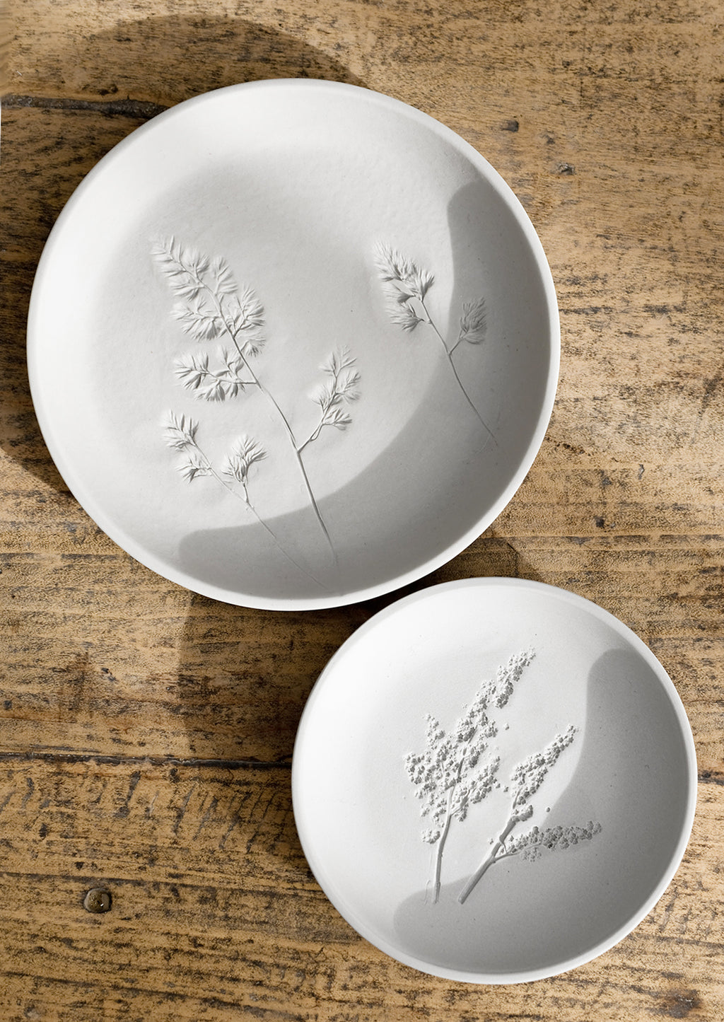 Small / Grey: Botanical imprint porcelain plates in grey.
